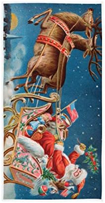 Santa i njegov sanjke koji lete iznad uspavanog sela na Badnjak viseći ručnike za kupatilo Dekorativne krpe